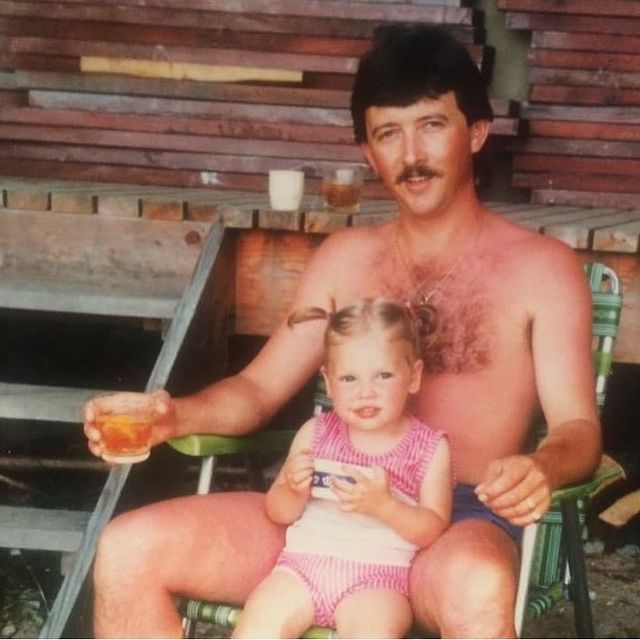 Haley Jane Bristowe' s childhood photo in a pink swim suit with her father.